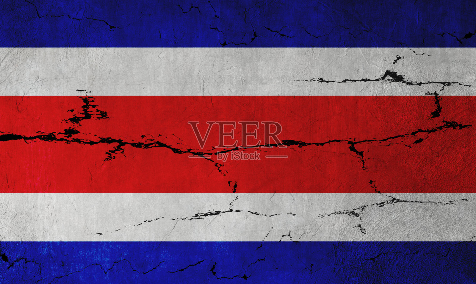 裂缝墙上的哥斯达黎加国旗照片摄影图片