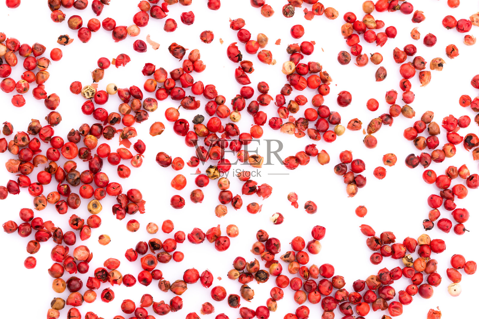 粉色的花椒种子孤立在白色的背景。照片摄影图片