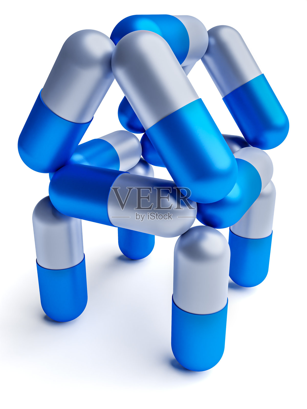 House从胶囊中分离出白色药片。医学的概念照片摄影图片