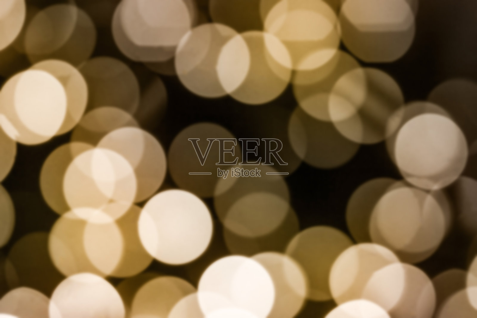 美丽的抽象背景-高光从一个花环，一个温暖的黄色散焦模糊的形象照片摄影图片