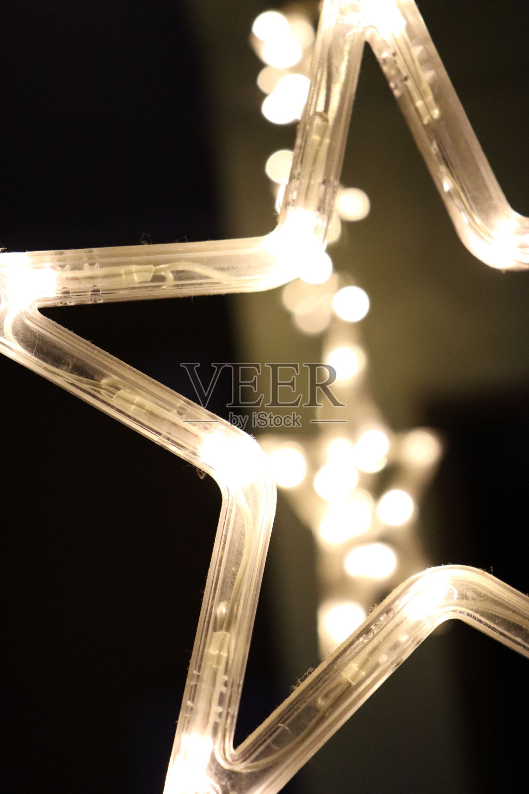 一个被照亮的圣诞星星的特写镜头照片摄影图片