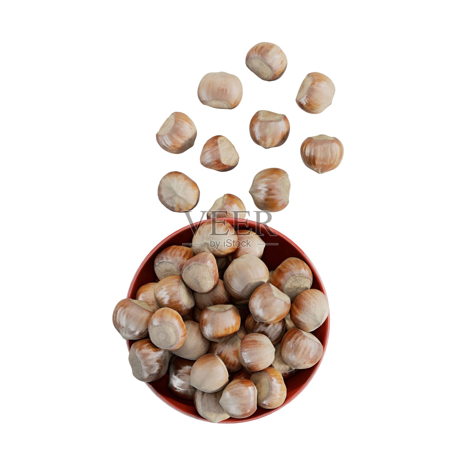 把榛子放在碗里，放在白色的碗里照片摄影图片