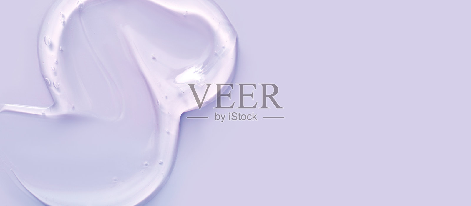 纹理凝胶血清在紫色背景与地方的文字照片摄影图片