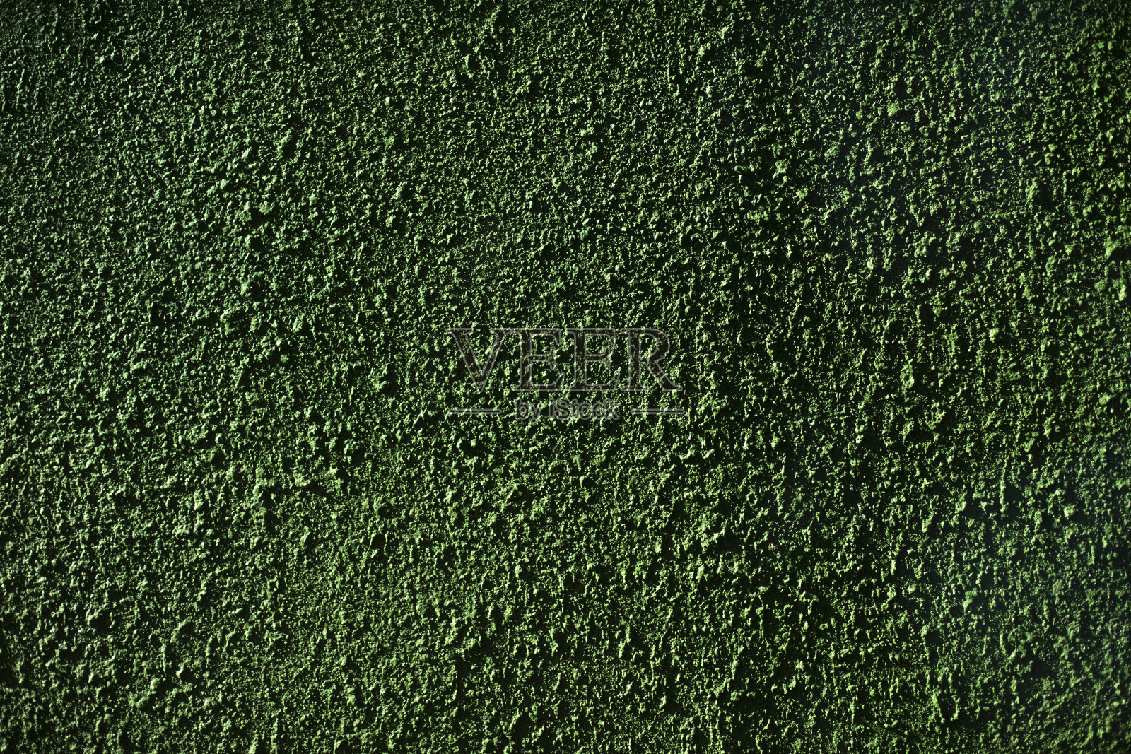绿色的墙。漆表面。粗糙度纹理。照片摄影图片