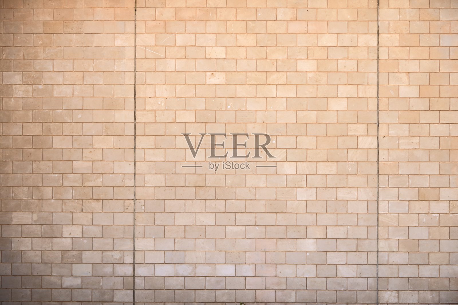 石砖砌成的黄色墙壁照片摄影图片