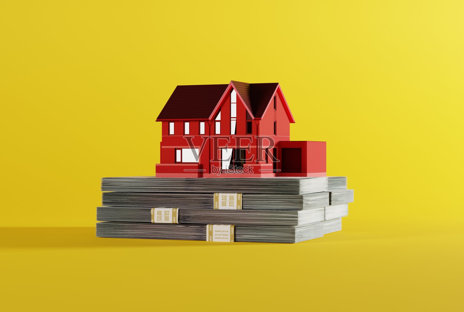 房子模型上有一捆钞票，钱。照片摄影图片