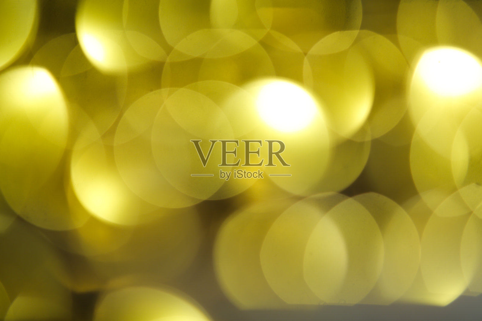 抽象的橙色和金色深色背景与发光的绿松石颗粒。照片摄影图片