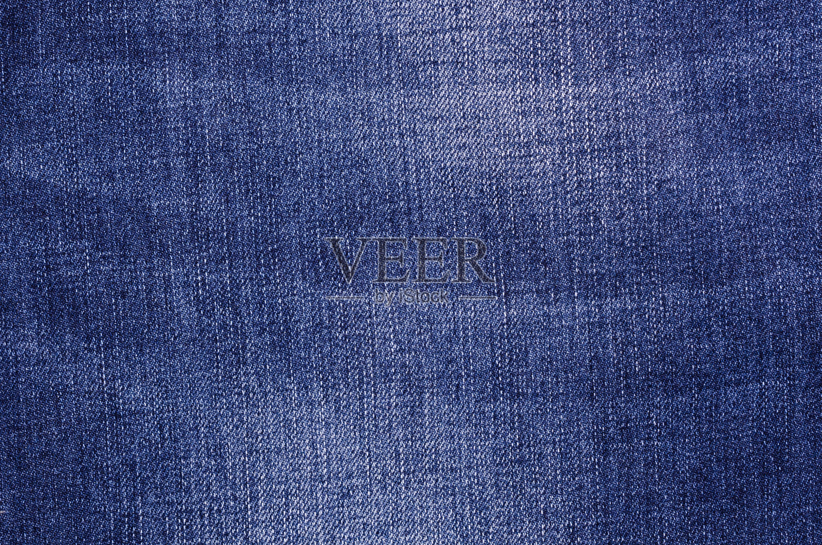 蓝色牛仔裤的一部分。照片摄影图片