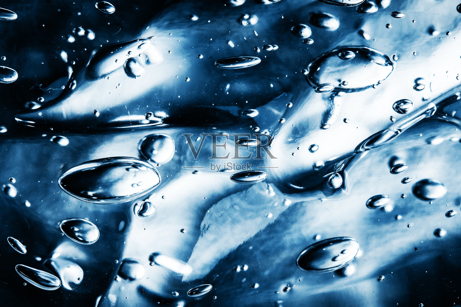 蓝色水凝胶图案背景。抽象的圆形气泡形状气泡液体背景。照片摄影图片