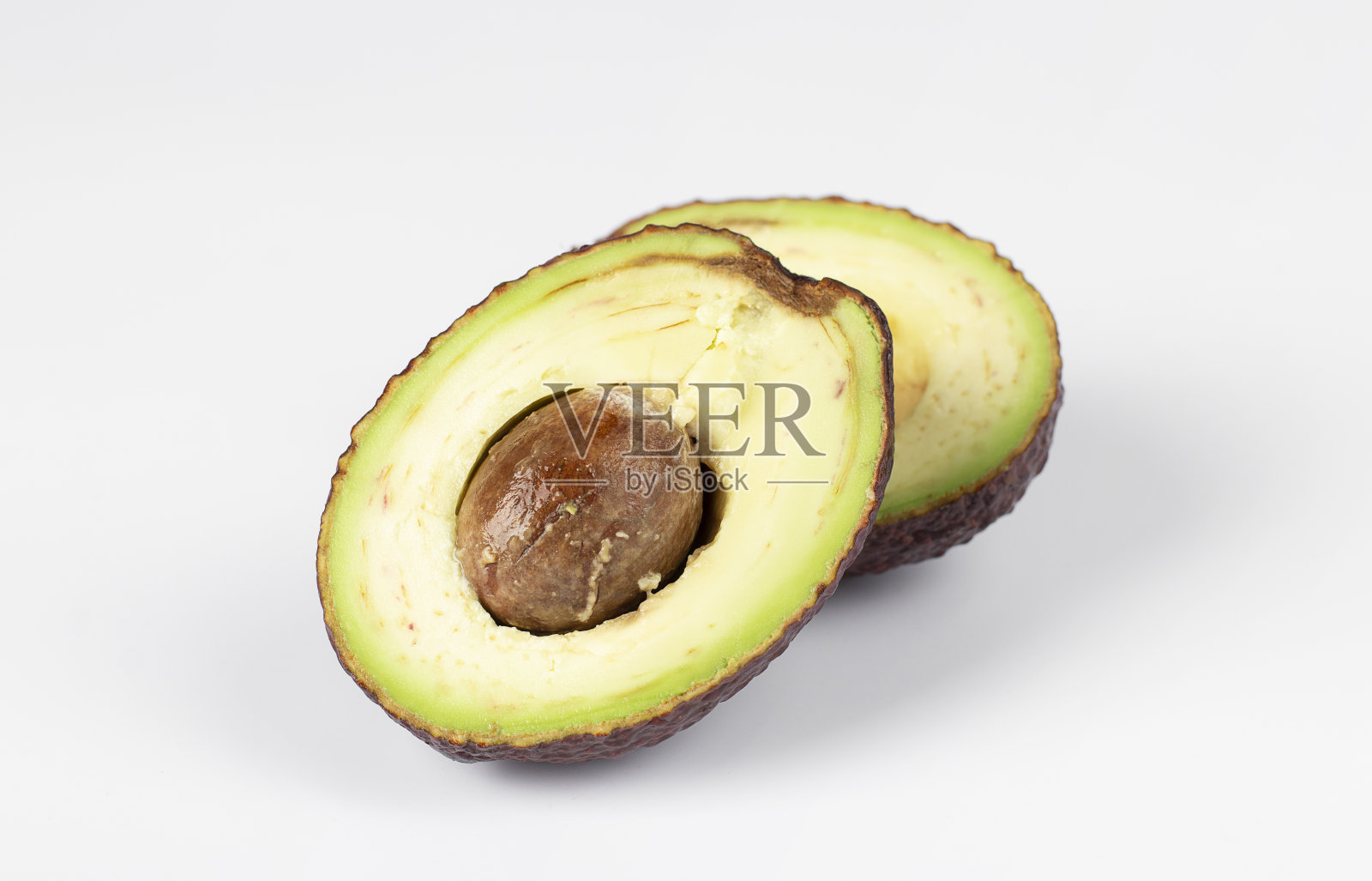 两半白底红牛油果照片摄影图片