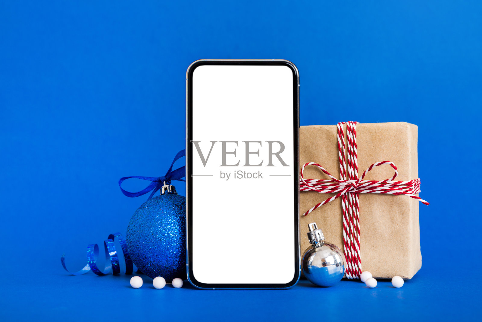 圣诞装饰手机样机，用于APP展示照片摄影图片
