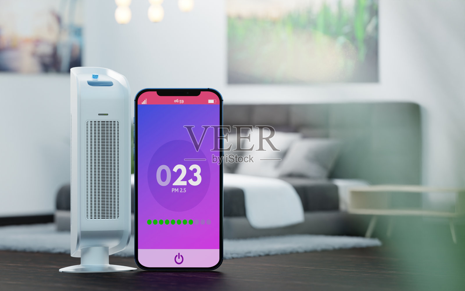 一个空气净化器和一个手机，在一个房间，卧室的后台有一个关于空气污染的应用程序。照片摄影图片