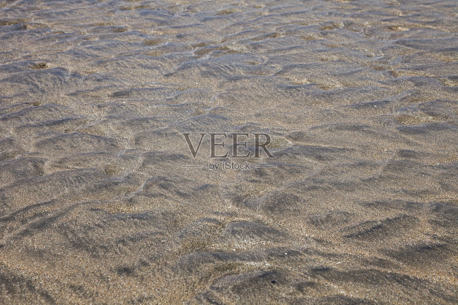 沙滩上的水纹理特写镜头照片摄影图片