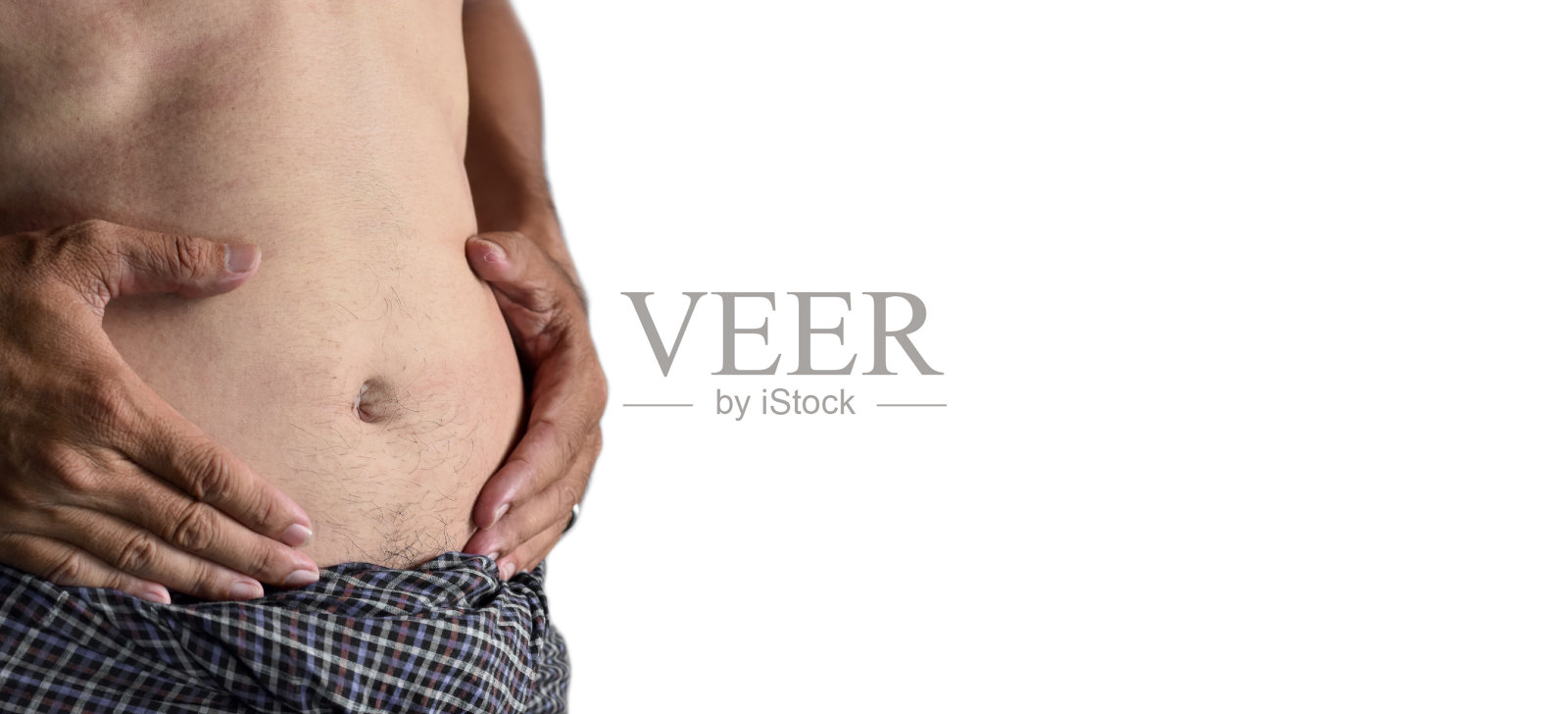 亚洲人的腹部。中枢性肥胖、腹部脂肪、腹胀或饱腹的概念。照片摄影图片