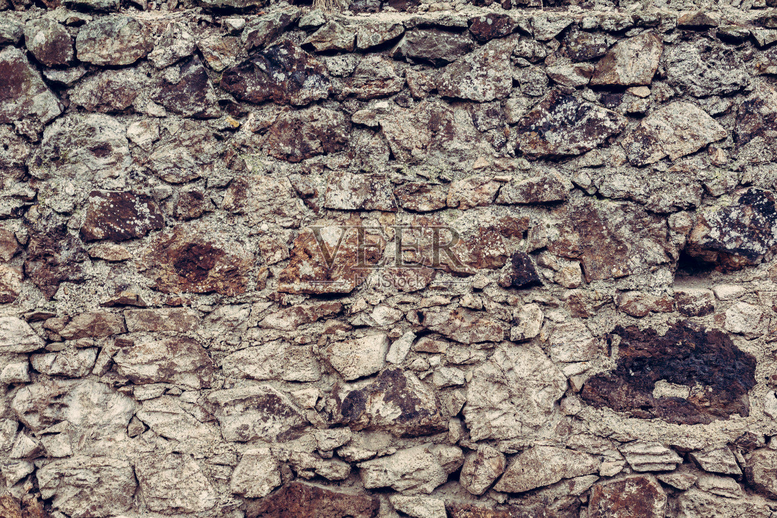 古堡的石墙有古老的石头纹理。照片摄影图片