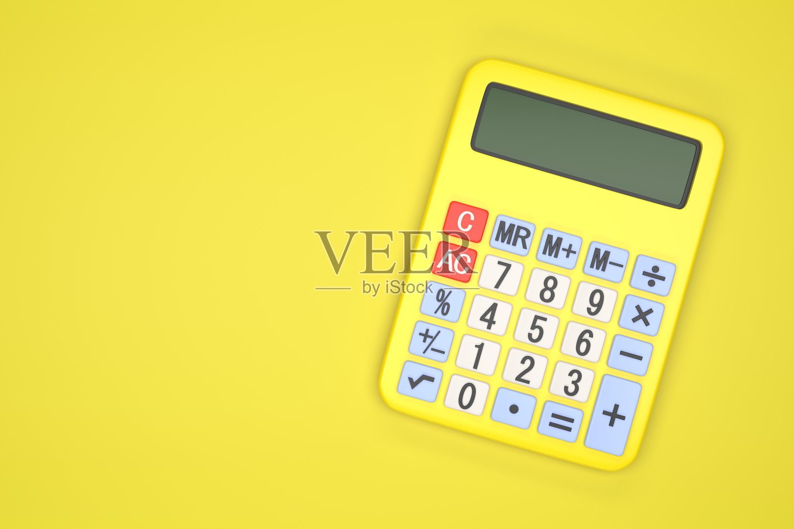 黄色背景上的黄色计算器照片摄影图片