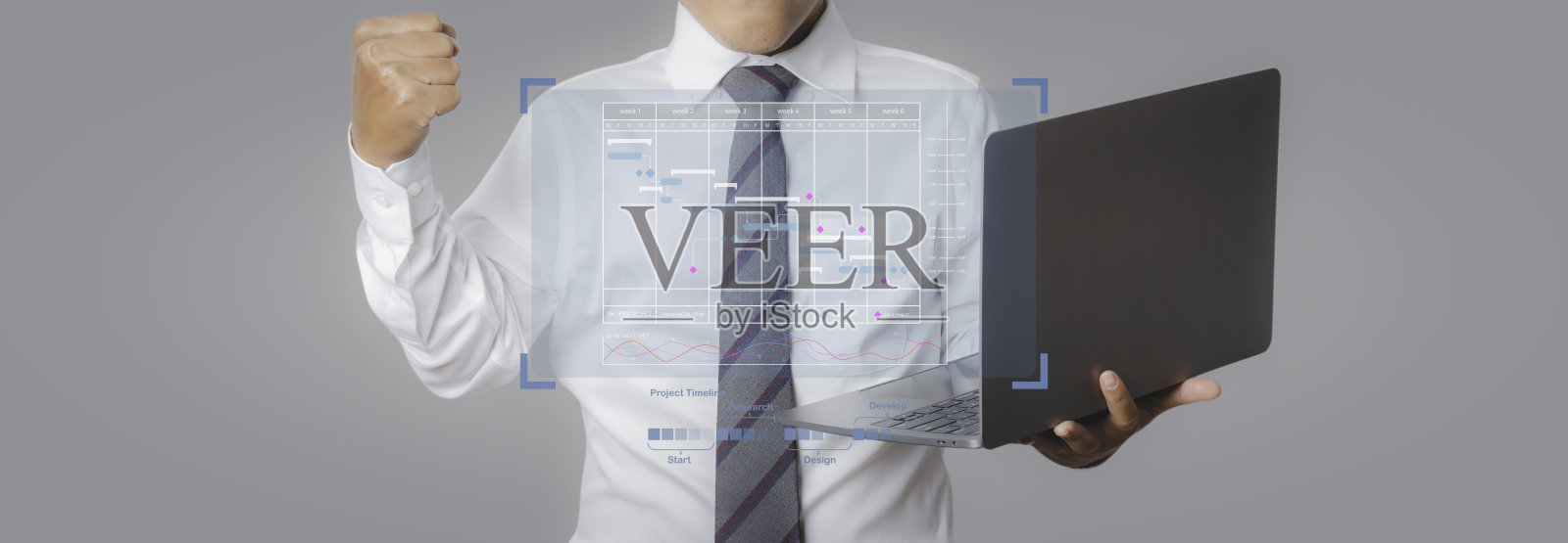 项目时间表管理。商人用笔记本电脑在虚拟屏幕上设计计划时间表。照片摄影图片