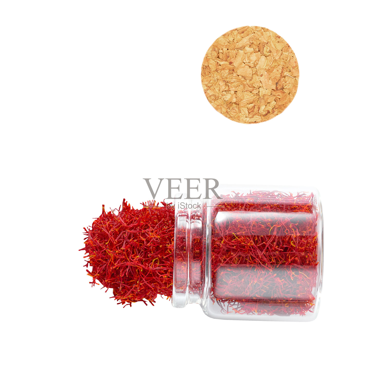 柱头藏红花溢出玻璃储存罐孤立的白色背景，俯视图。照片摄影图片