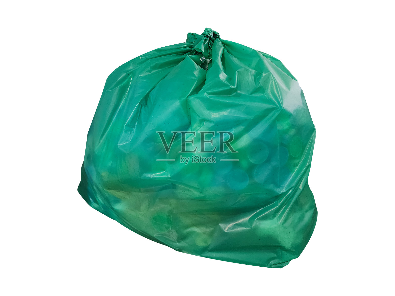 白色背景上的绿色垃圾袋。照片摄影图片