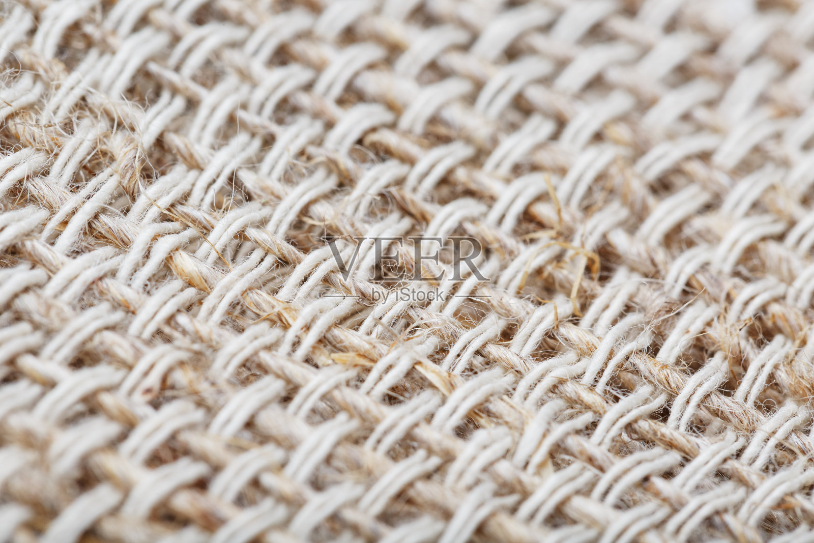以亚麻纤维为背景的粗麻布织物。照片摄影图片