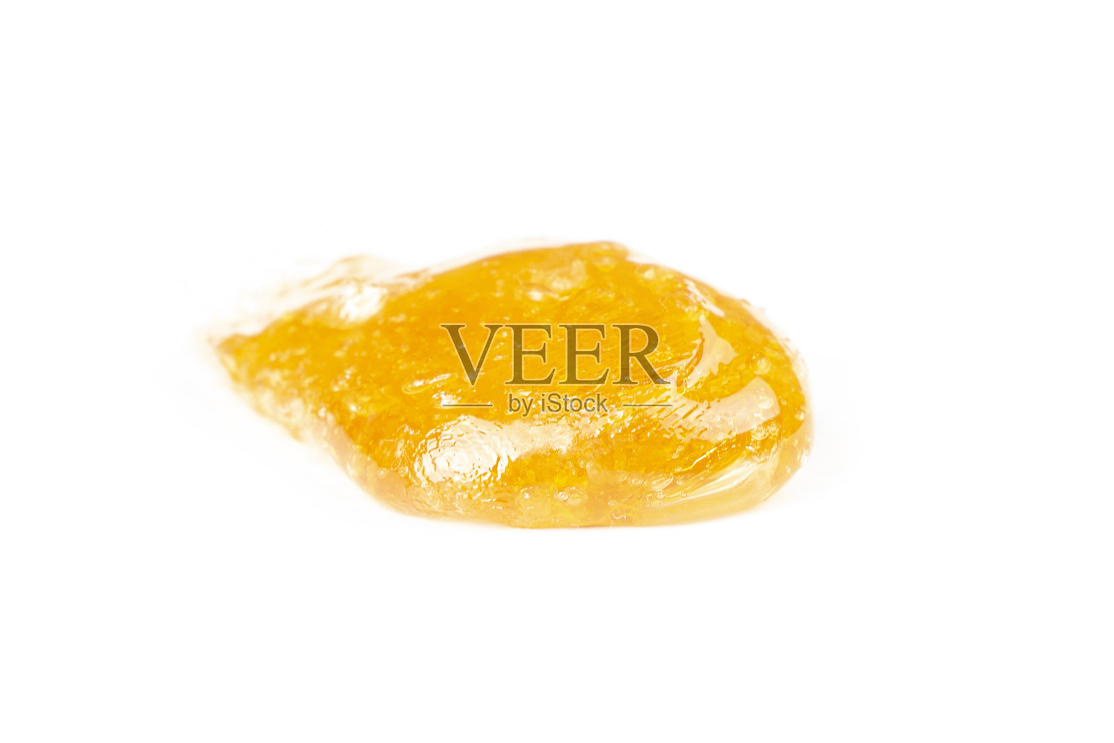 金大麻树脂分离提取物，白色底色，黄色涂抹照片摄影图片