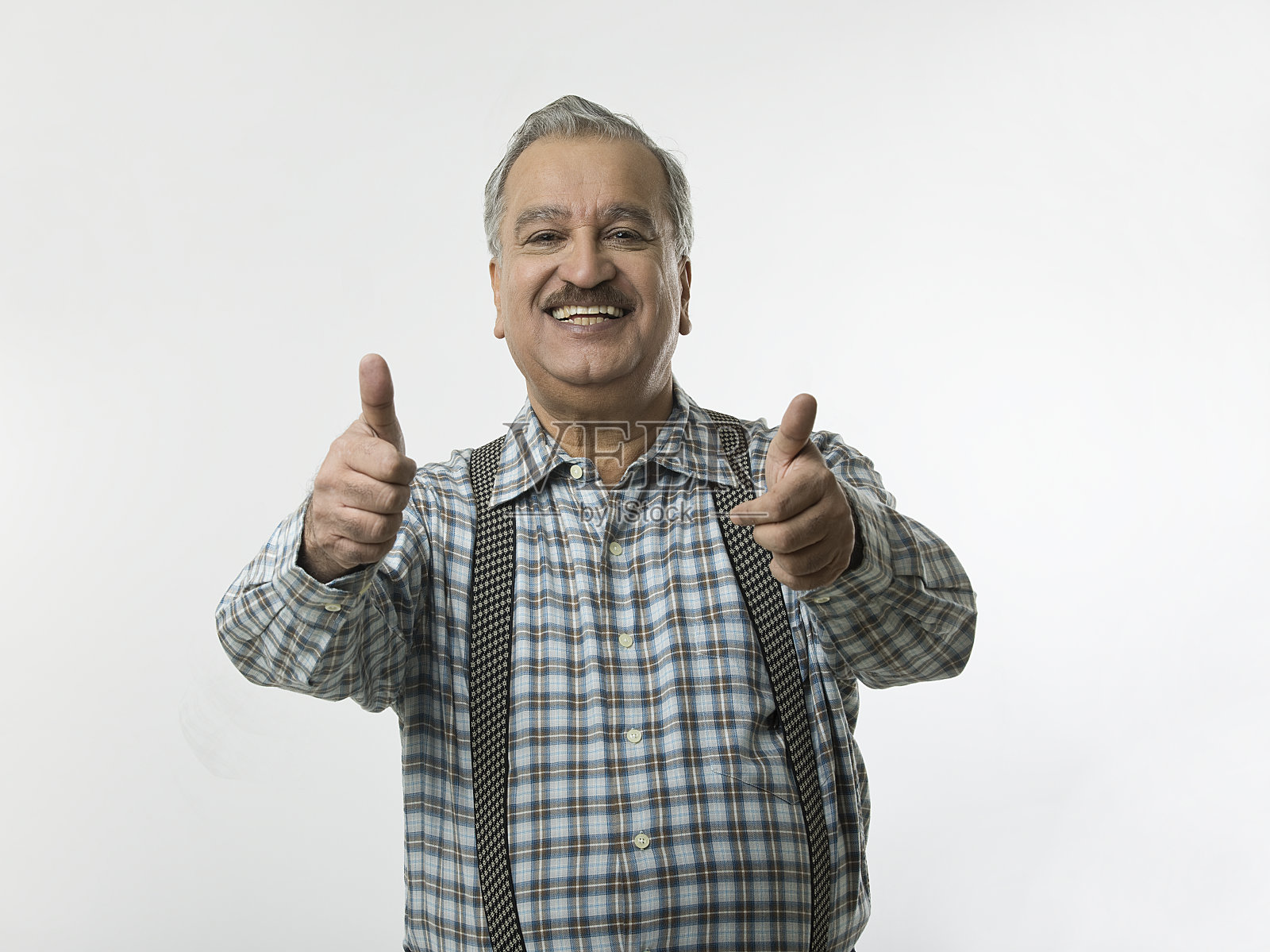 商人竖起大拇指的姿势照片摄影图片