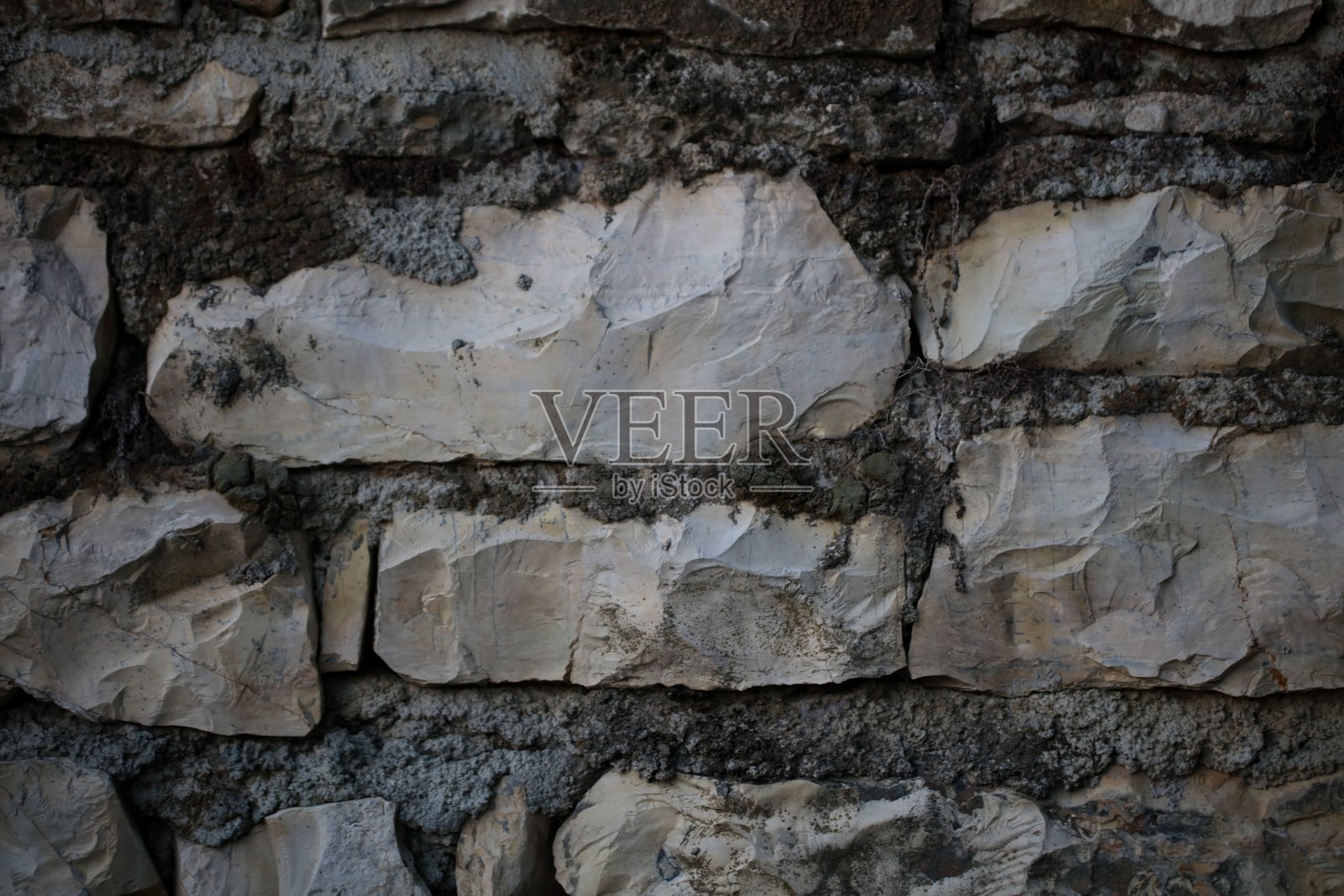 废弃的卡斯特里希腊村庄的20年石墙照片摄影图片