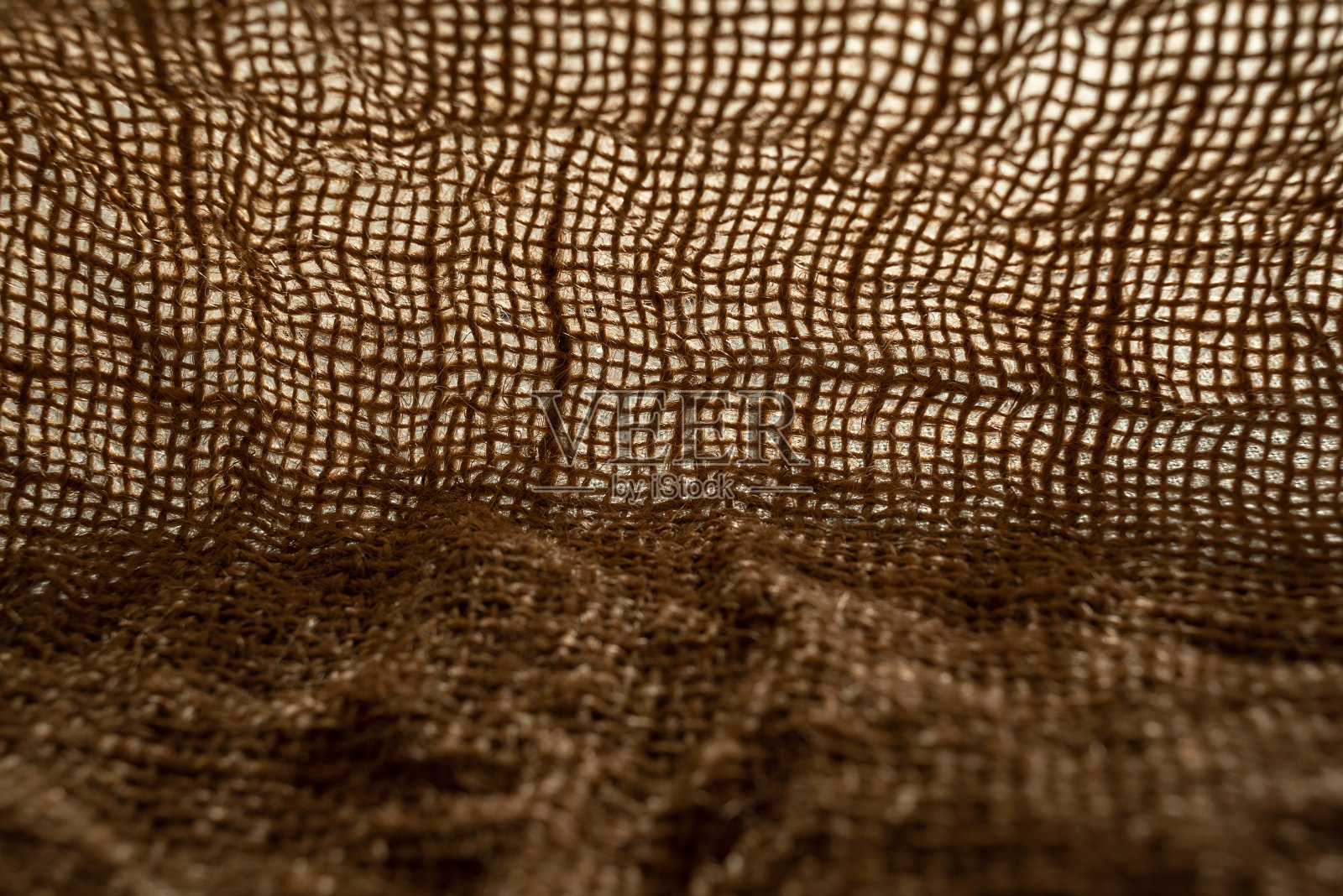 纹理为天然麻袋材质特写，带有天然褶皱和褶皱照片摄影图片