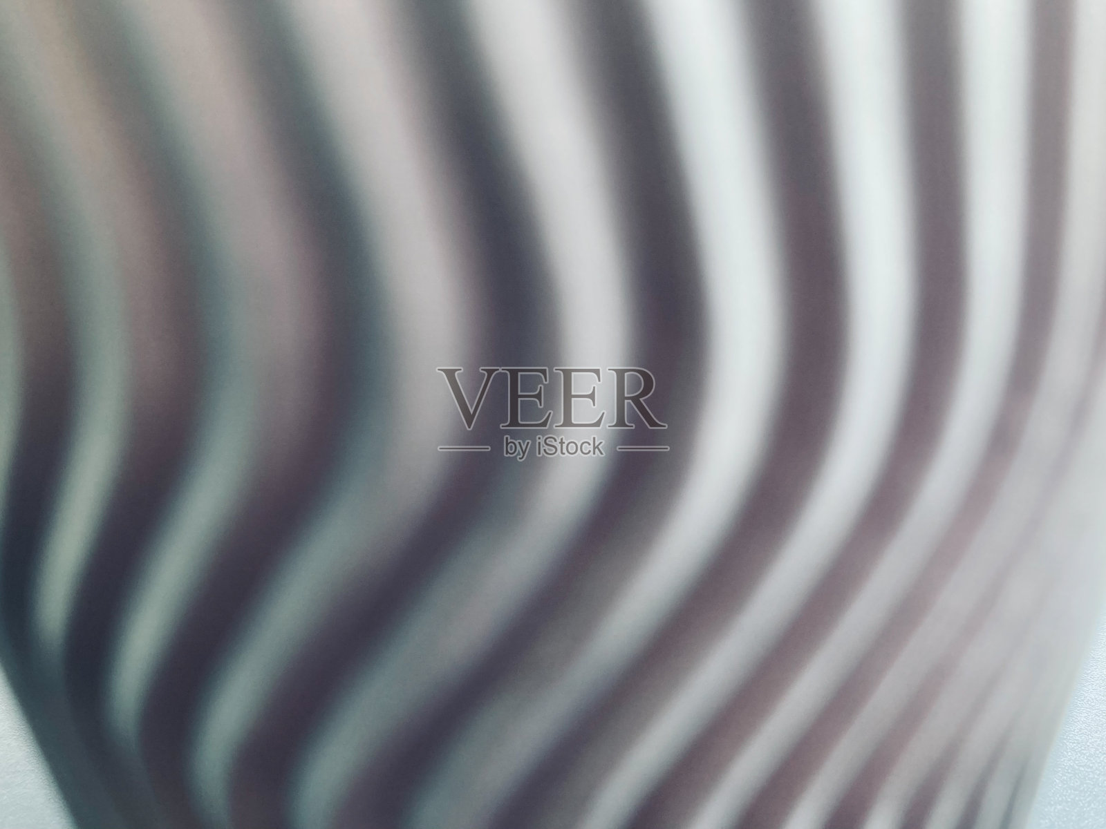 模糊的漩涡灰色纸与白光在底部照片摄影图片