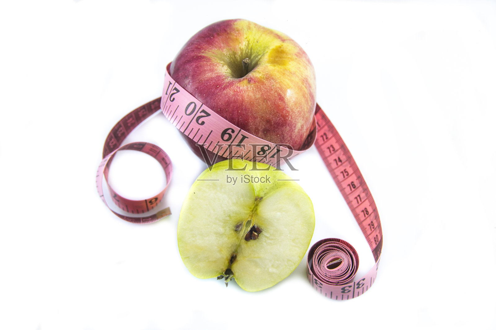 卷尺和青苹果健康饮食概念照片摄影图片