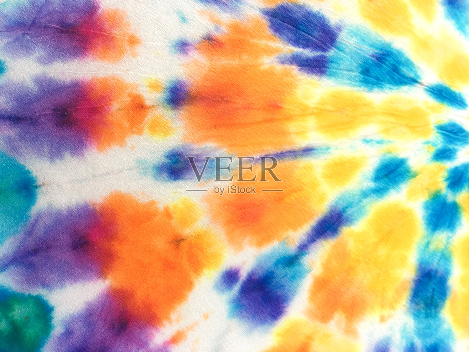 彩色现代螺旋扎染。摘要鲜艳扎染时尚印花。螺旋扎染效果背景。垃圾明亮螺旋扎染服装背景。照片摄影图片