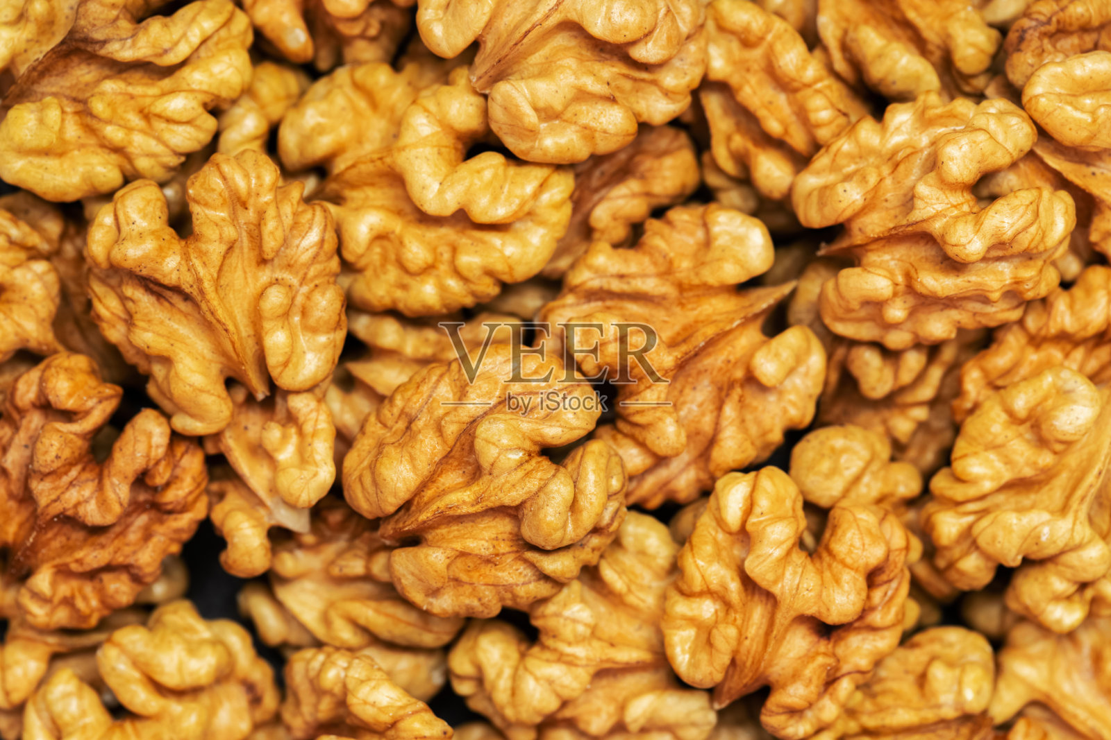 核桃的背景。内核核桃。前视图。素食或健康食品照片摄影图片