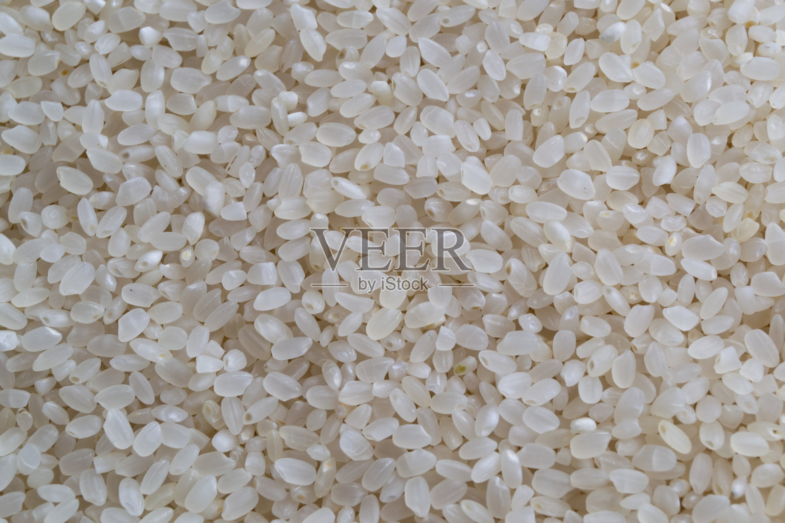 白色的大米纹理背景，特写镜头的大米背景照片摄影图片