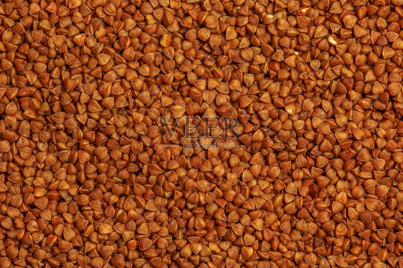 荞麦纹理背景。有机原料干荞麦谷物背景。照片摄影图片