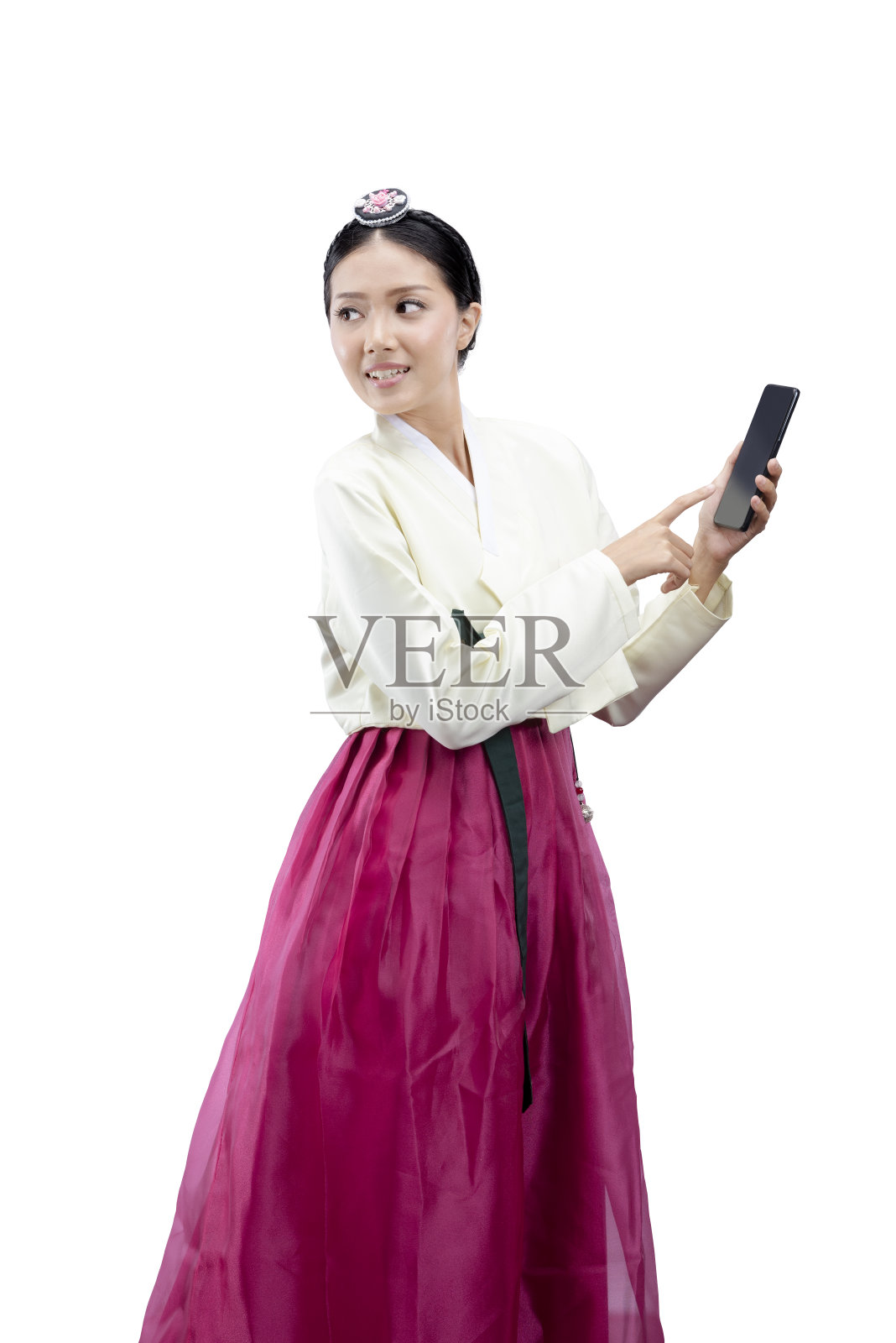 一名身穿韩服的亚洲妇女站在那里使用手机照片摄影图片