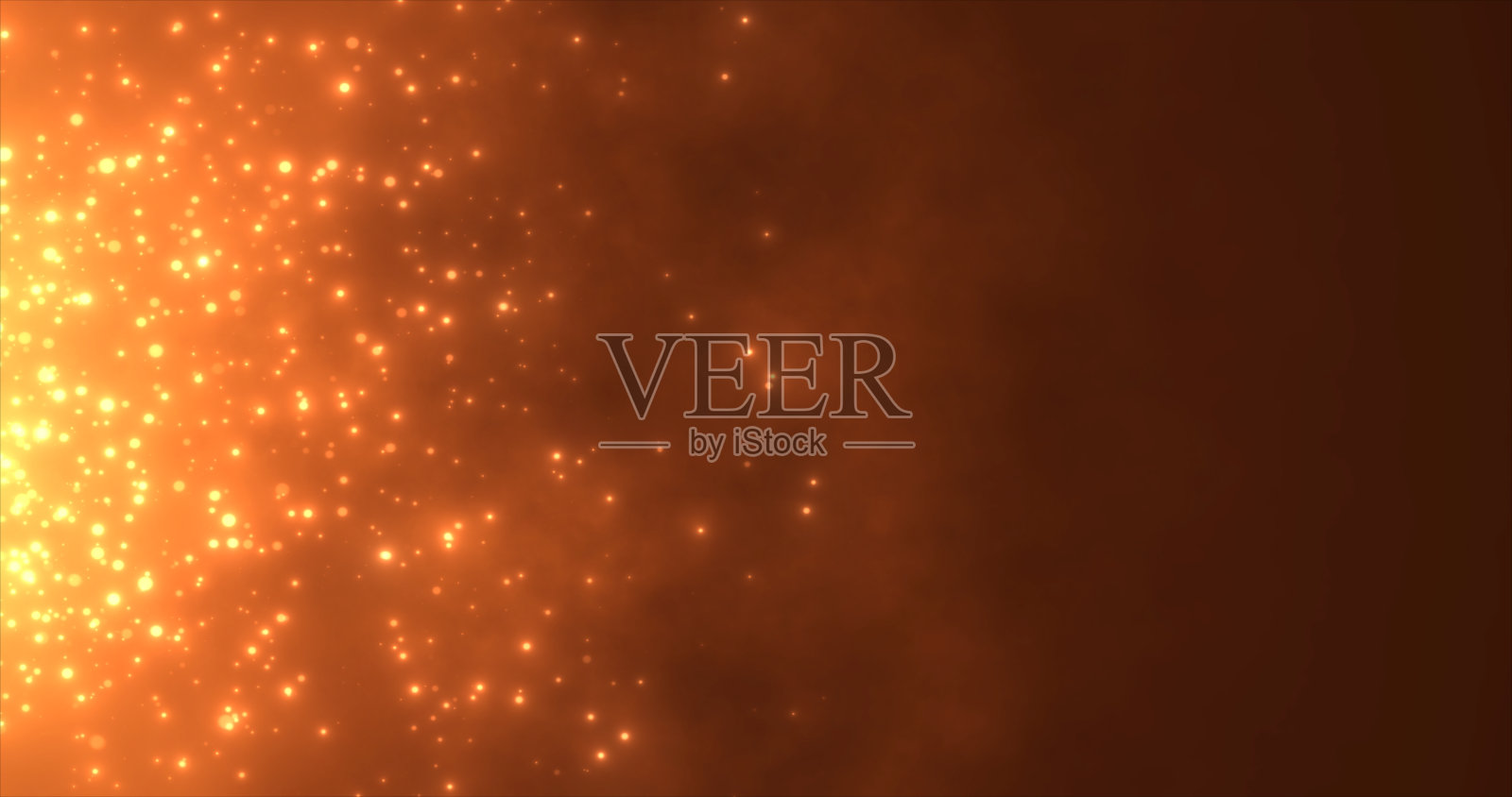 抽象的橙色火焰熊熊的粒子和火花发光美丽神奇的黑色背景。抽象的背景照片摄影图片