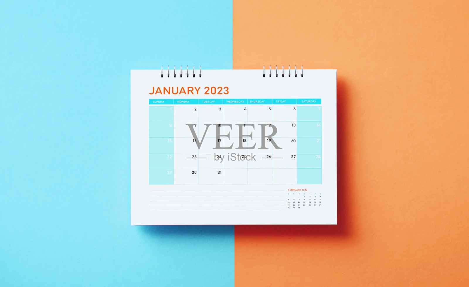 2023年1月日历，蓝色和橙色背景照片摄影图片