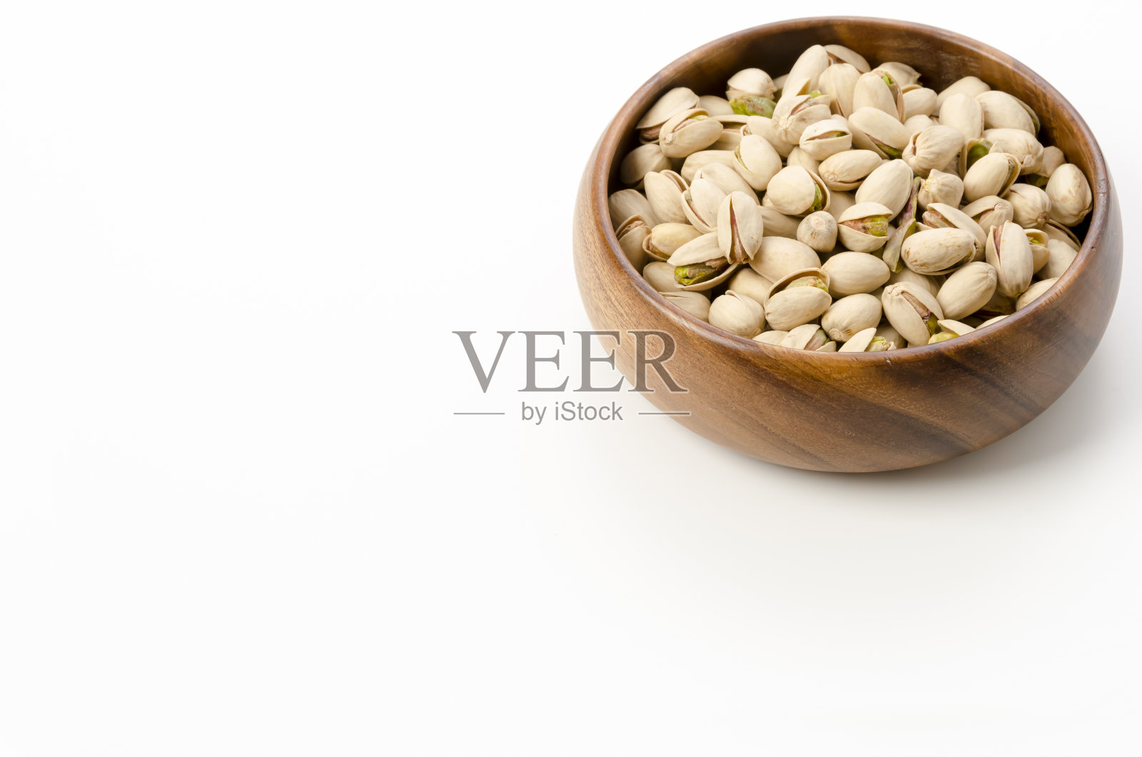 木碗里的开心果照片摄影图片