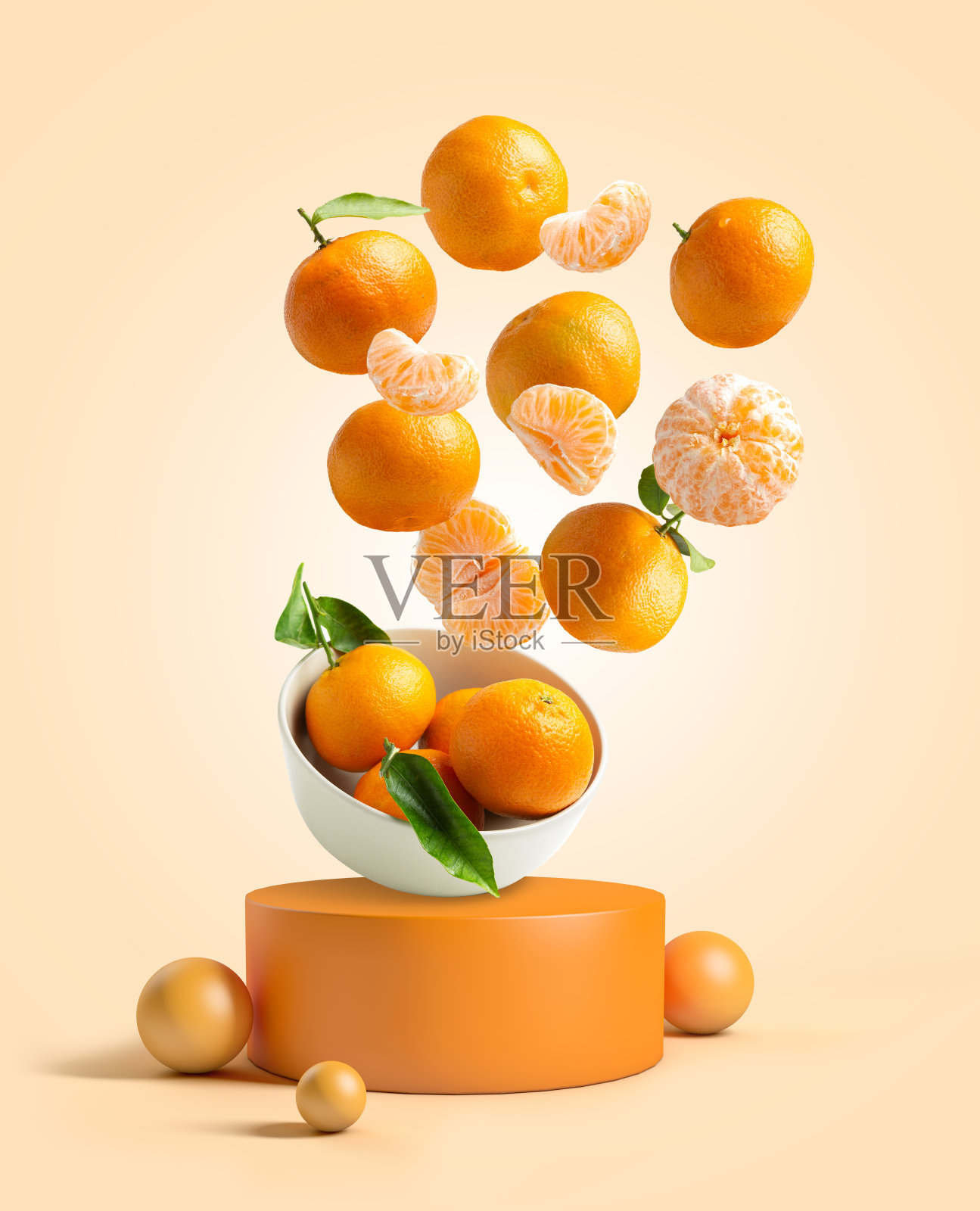 桔子落在讲台上的碗里照片摄影图片