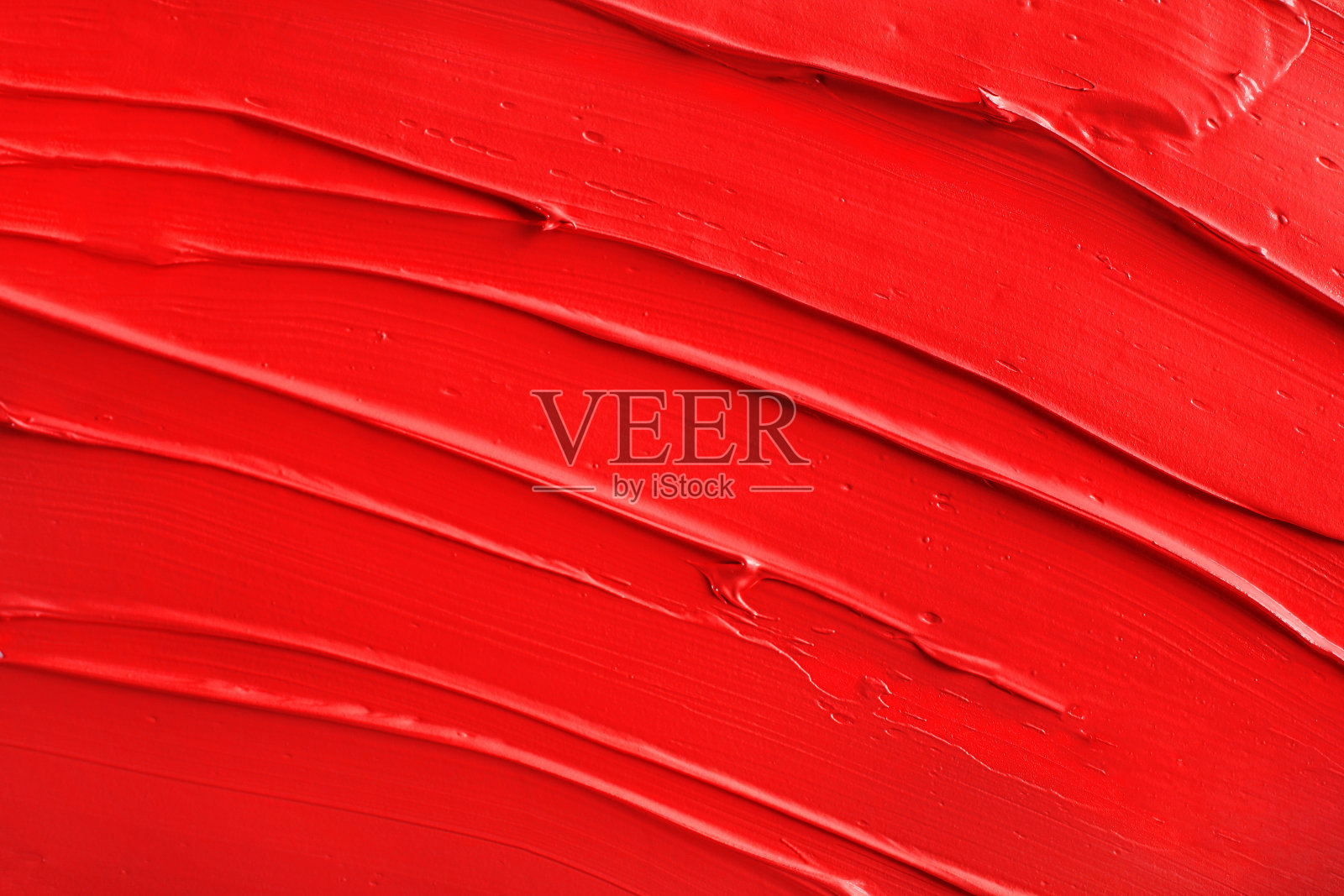 红色油漆纹理。红色唇膏的背景。俯视图照片摄影图片