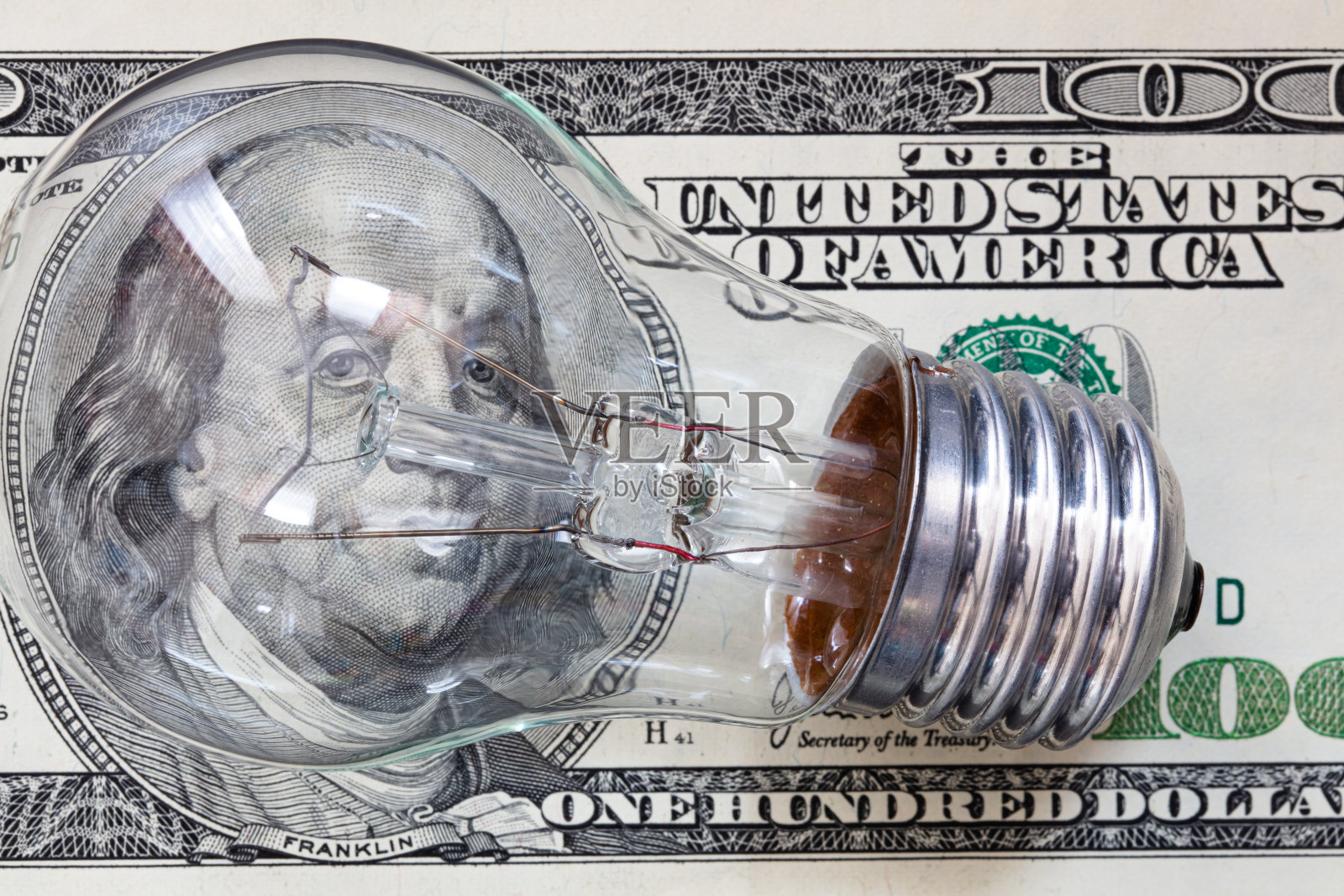 白炽灯泡100美元的背景照片摄影图片