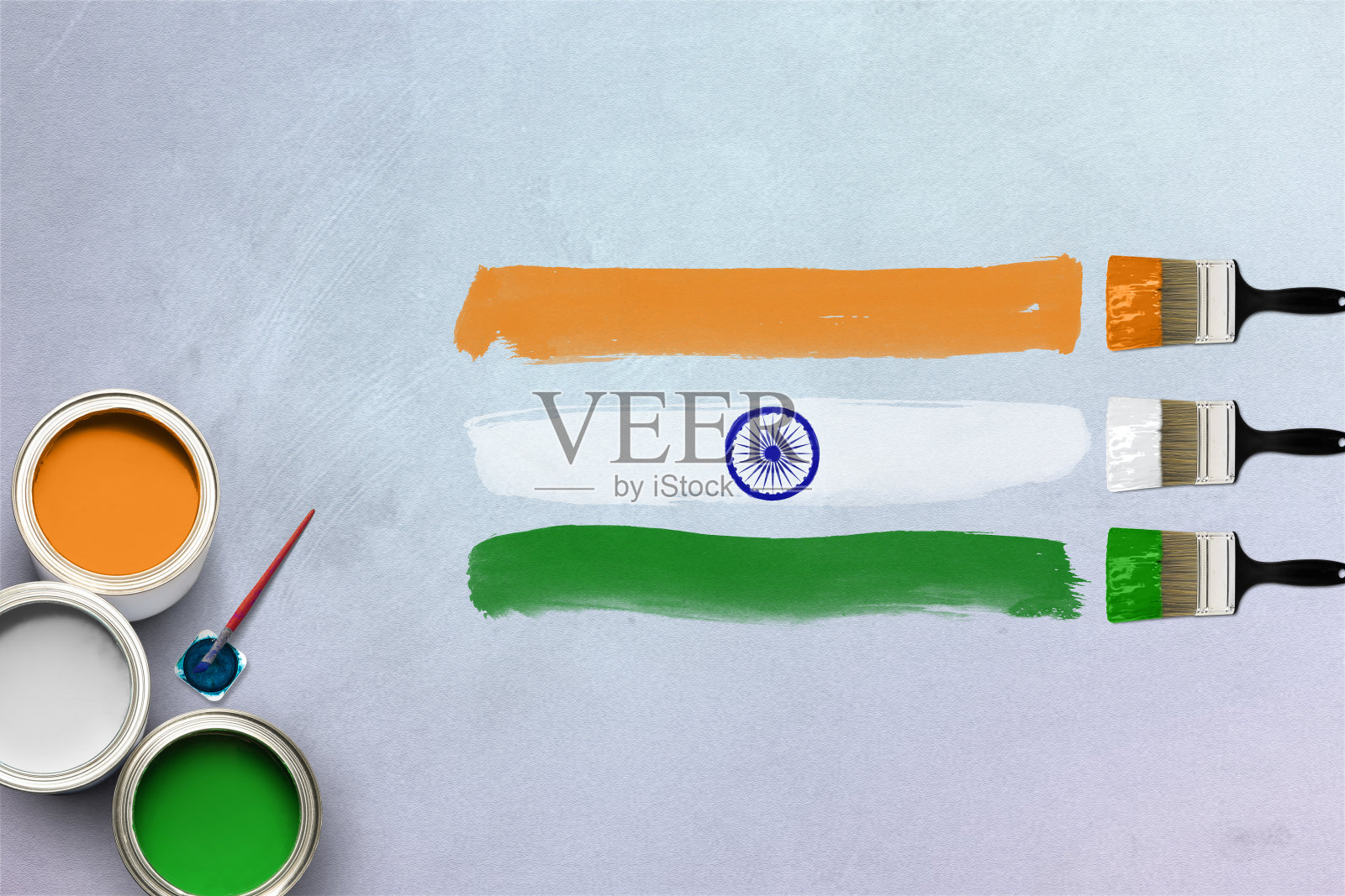 创意概念的印度三色旗创建使用油漆刷和彩色油漆罐。印度共和国日。印度独立日。印度的色彩。照片摄影图片