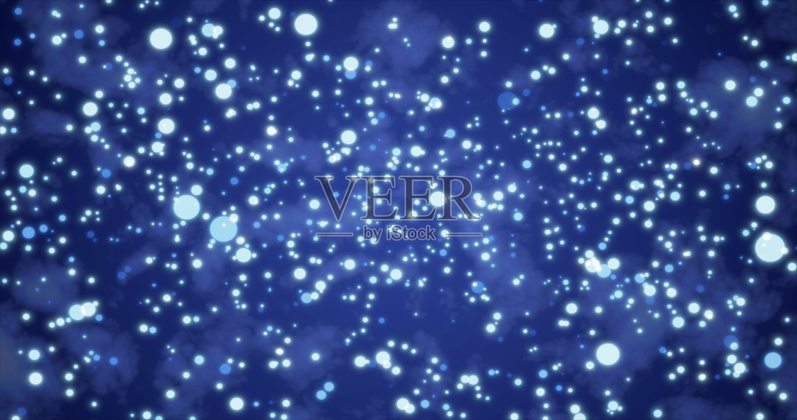 抽象明亮发光的节日蓝色圆圈与模糊效果和能量魔法散景在蓝色背景。抽象的背景照片摄影图片