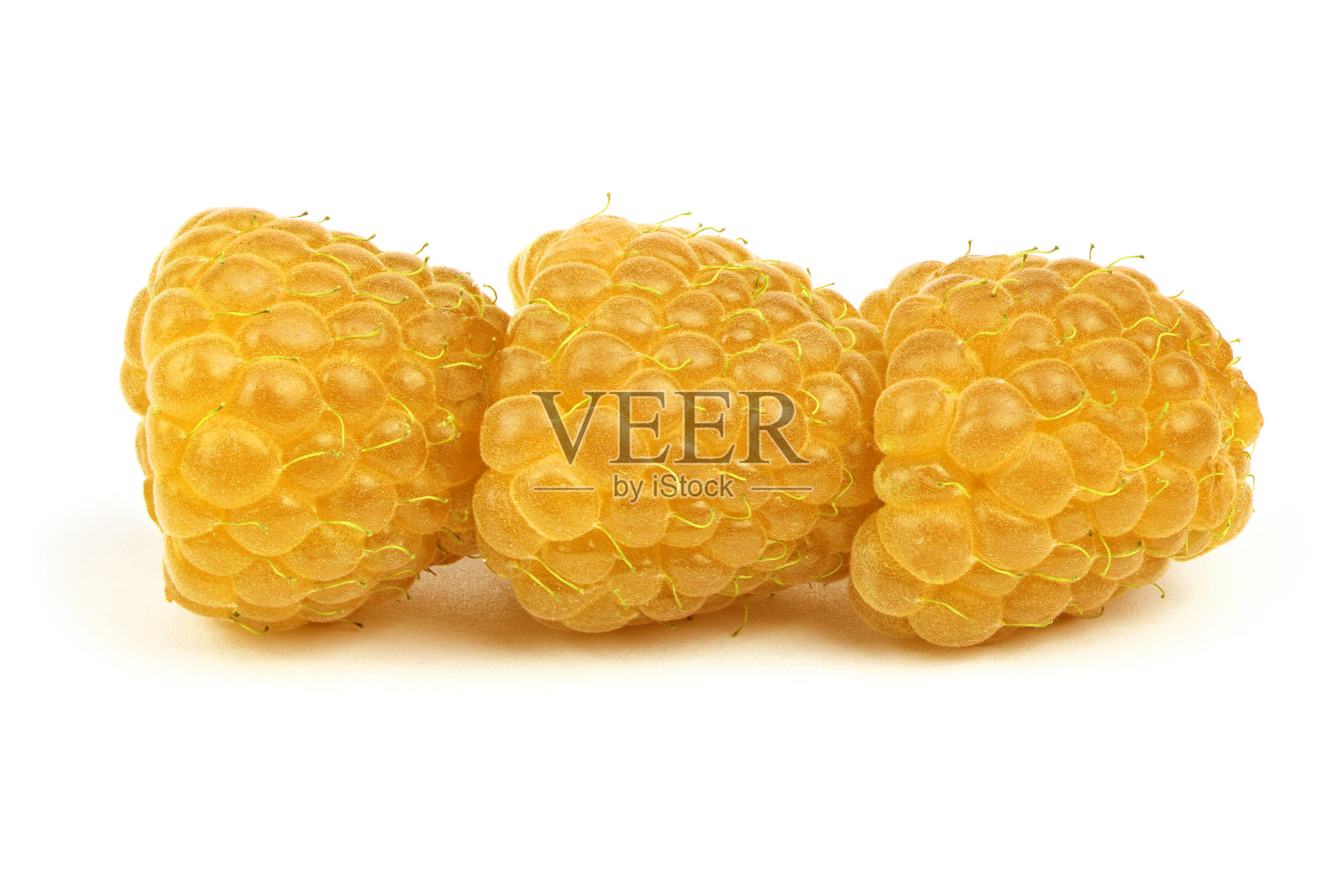 三颗黄色的覆盆子照片摄影图片