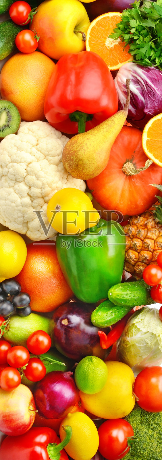 美丽的蔬菜和水果背景。垂直的照片。照片摄影图片