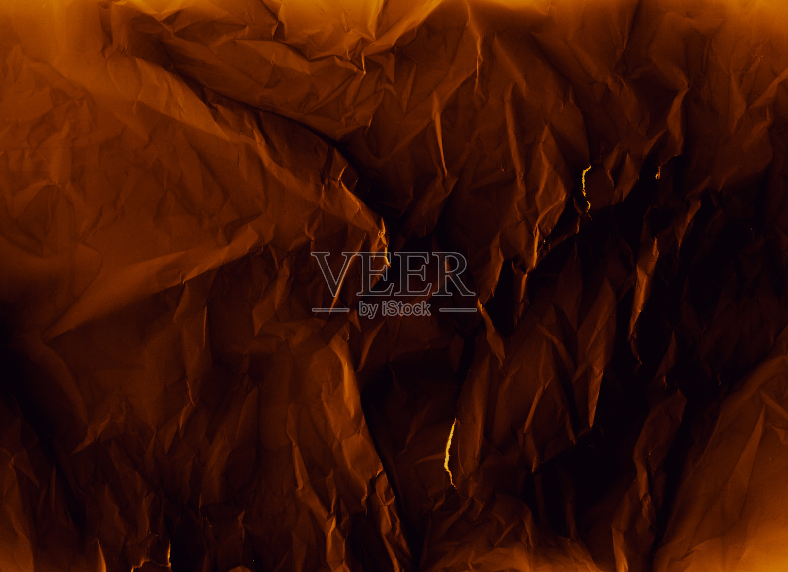 皱皱的纹理心疼纸橙黑色照片摄影图片