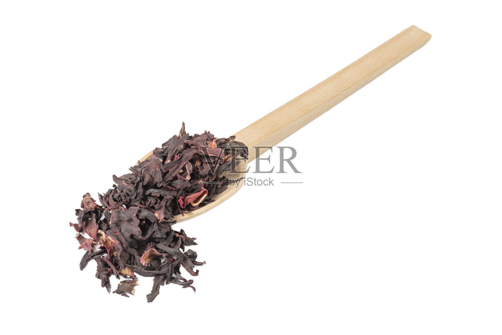 木勺上的干木槿茶，白色背景。赫伯特。花草茶。食品成分。照片摄影图片