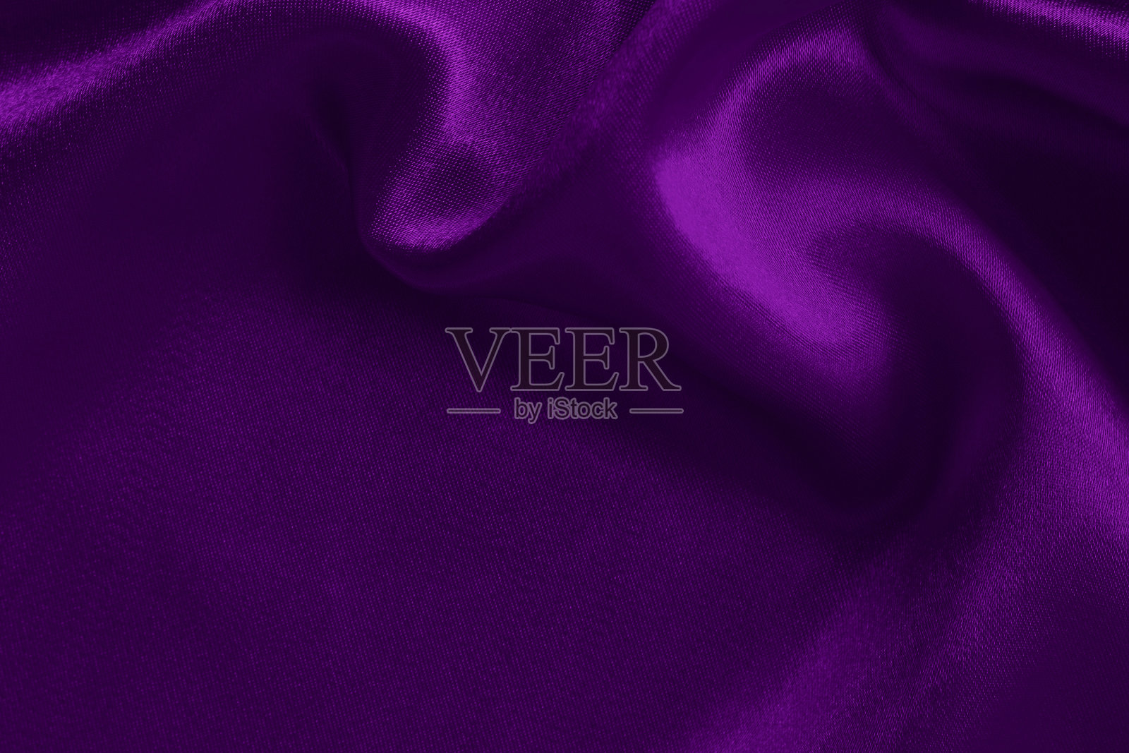 紫色织物织物纹理的背景和设计艺术作品，美丽的褶皱图案的丝绸或亚麻。照片摄影图片