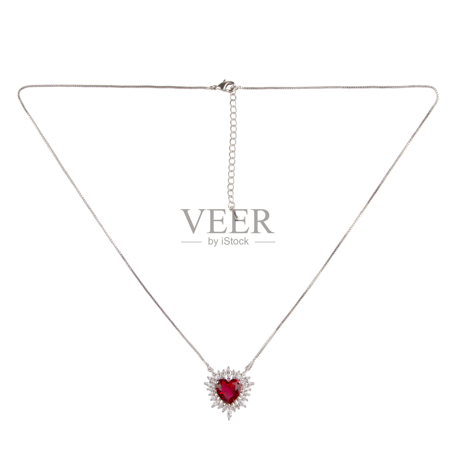 Silver pendant with diamond and ruby ​​on a thin chain on a white background照片摄影图片
