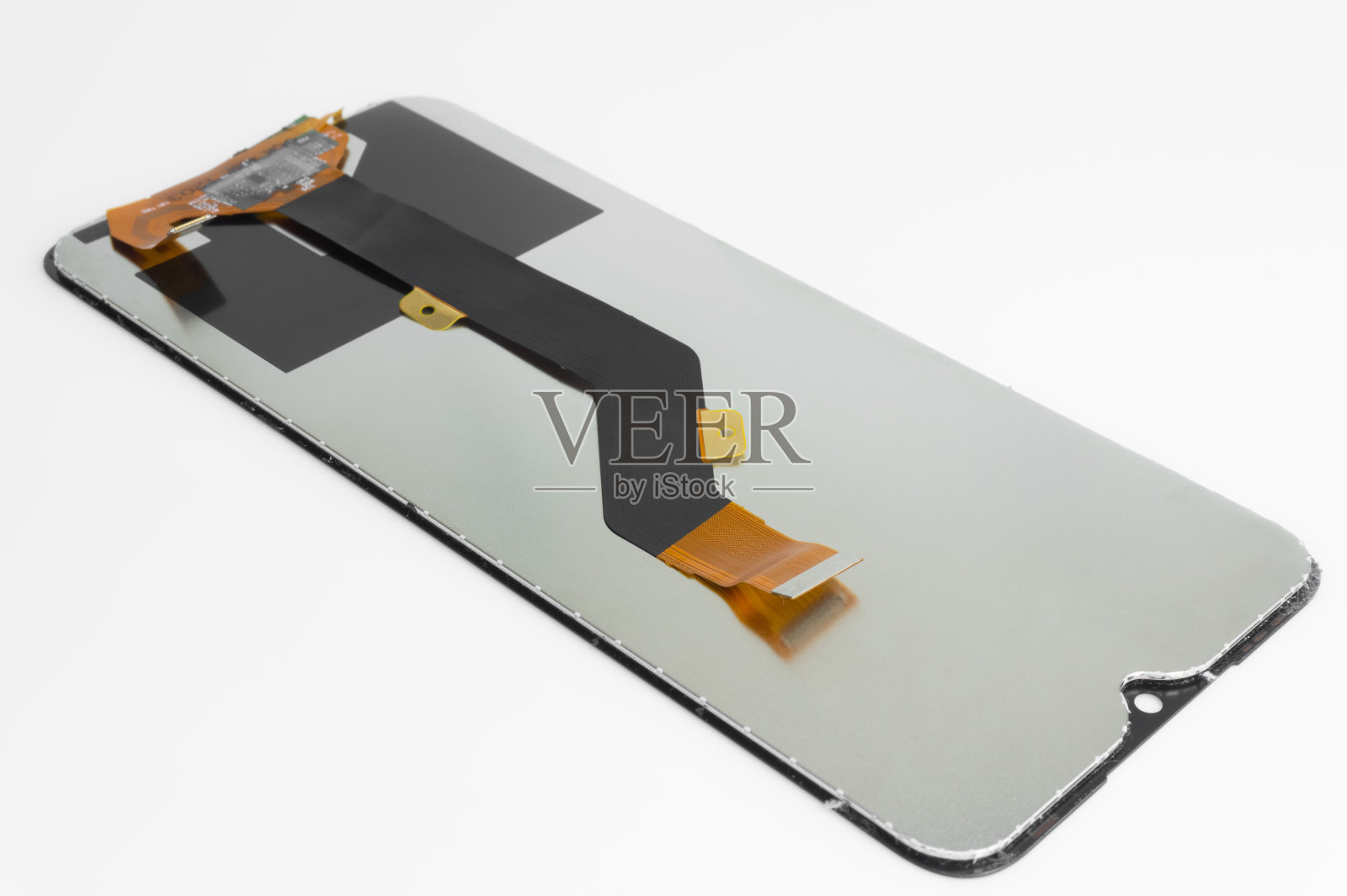 带有柔性电缆的智能手机屏幕特写照片。改变屏幕。照片摄影图片